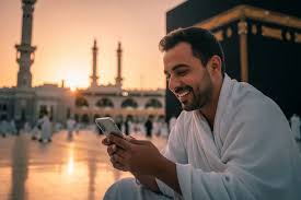 Pilgrims using smartphone in Masjid al-Haram courtyard in Makkah, connecting to free WiFi during Umrah without SIM card.